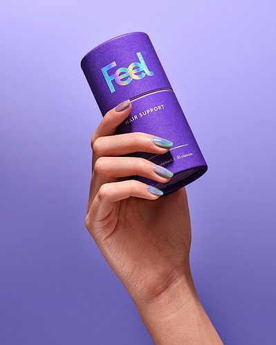 A compelling composition capturing the Hair Support product delicately held in the hand of a girl, with her nail polish complementing the color of the shampoo. This still-life imagery is thoughtfully arranged and skillfully photographed by David Lineton.