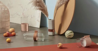 A top-down capture showcasing various items including different-shaped tables, a bench, a carpet, and other objects artfully arranged in the scene. This expertly composed image is skillfully captured by David Lineton, a specialist in still life photograph