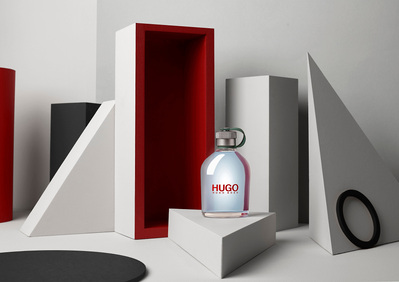 An artfully composed photograph showcasing Hugo perfume placed on a triangular surface. This captivating image is skillfully crafted by David Lineton, a distinguished professional in the field of advertising photography in London.