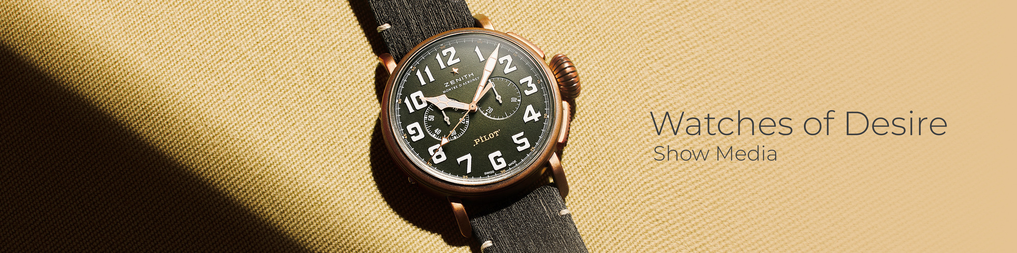 Zenith Watch captured in a shaft of warming light. The watch sits with a graphic shadow.