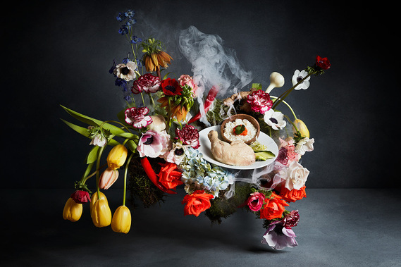 Gaggenau Food Still life. Chicken dish by Santiago Lastra are displayed around a vibrant floral arrangement. smouldering smoke ties in the rich and dark dutch masters series