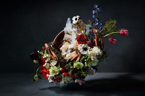 Gaggenau Food Still life. Oriental food parcels dish by Elizabeth Haigh are displayed around a vibrant floral arrangement. smouldering smoke ties in the rich and dark dutch masters series