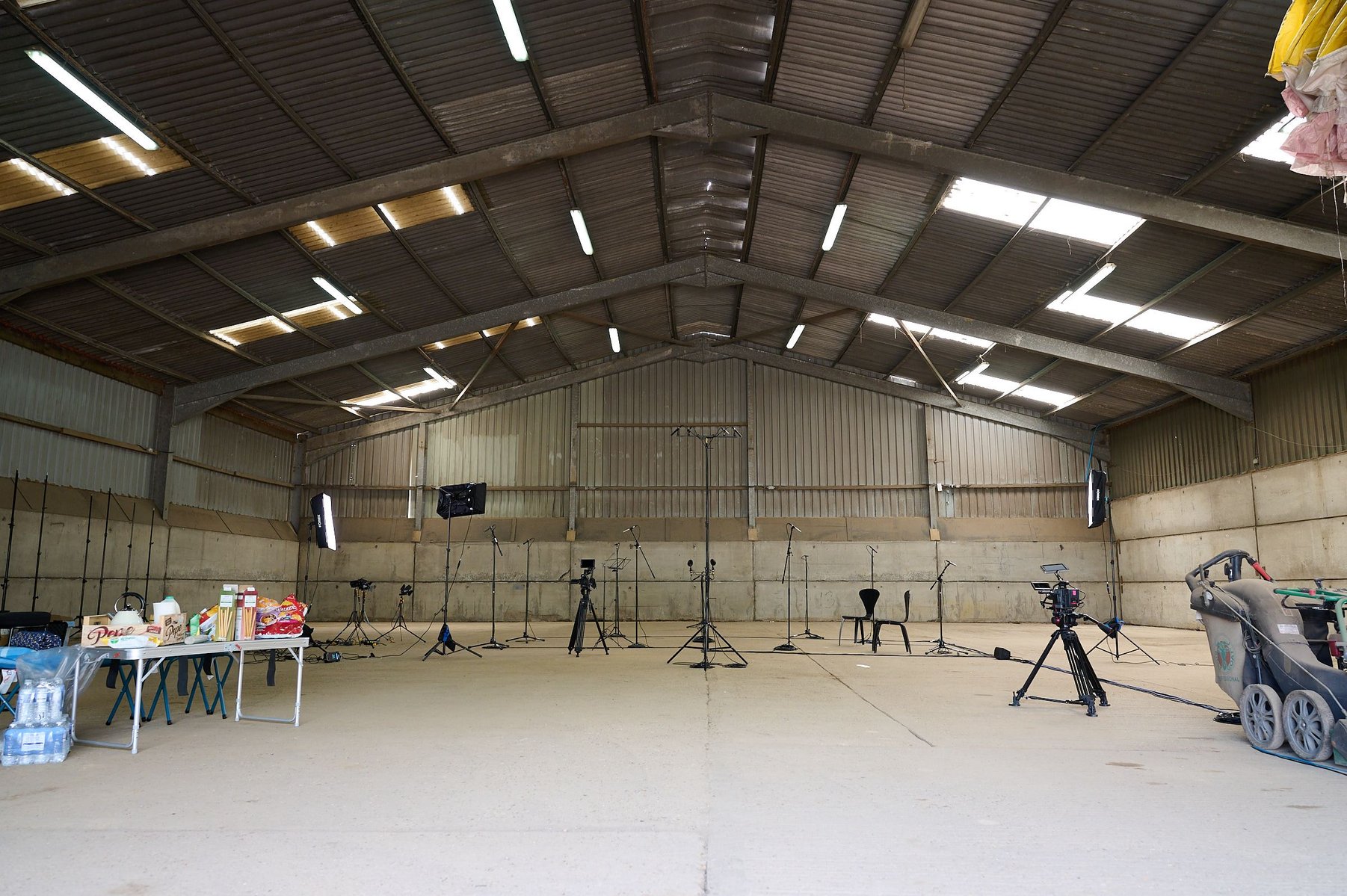 A barn in the Chiltern's ready for an Orchestra with music stands and microphones