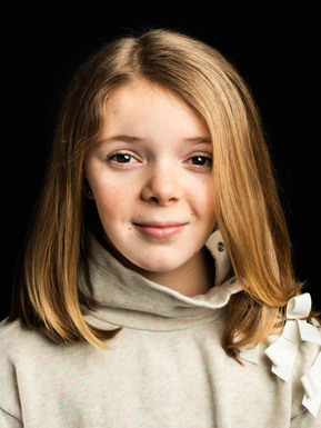 child actor head shot black background