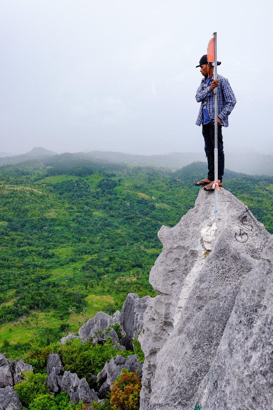 Jimmy balances atop a ridge on Gunung Fatuleu, an isolated butte in the village of Nunsaen, on May 1, 2019, 40 miles northeast of Kupang, Indonesia.