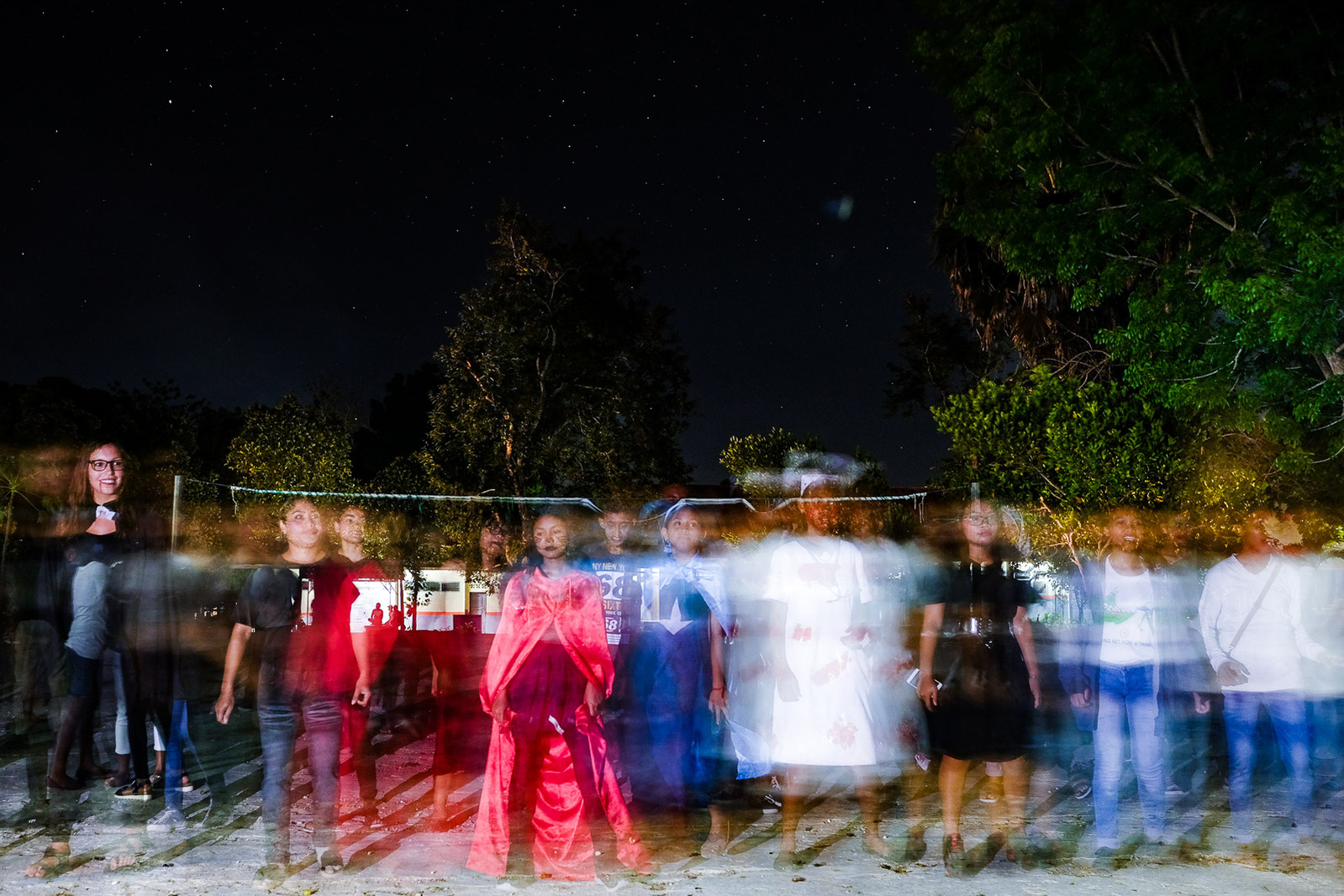 Peace Corps volunteer Daniela Perret (leftmost) dances with students at a Halloween party at the school where she teaches on November 2, 2019 in the village of Batakte, nine miles southwest of Kupang, Indonesia.