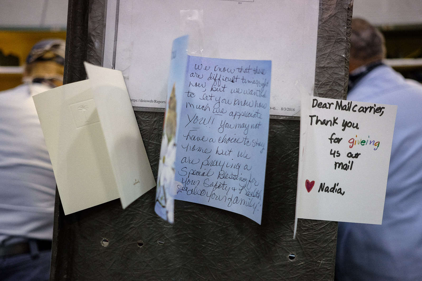 Thank you notes seen taped to a mail case at the USPS’s Boardwalk branch on Tuesday, May 5, 2020 in Saginaw Township, Mich.