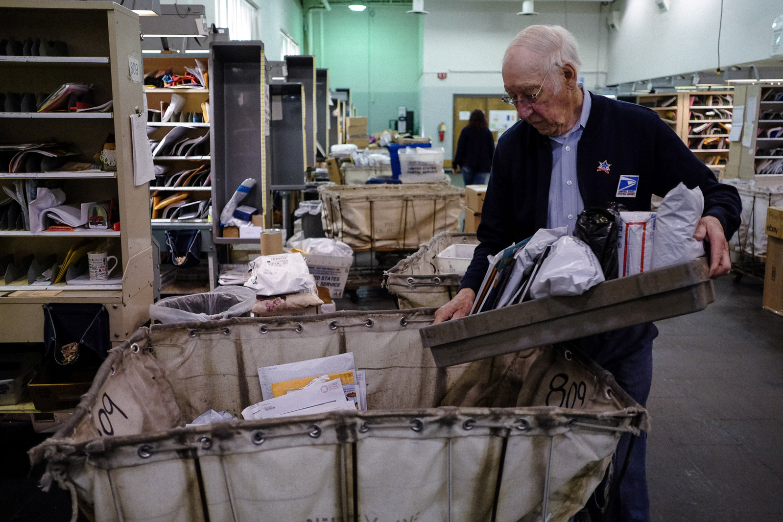 Letter Carrier Warren Wedding sorts mail for his route at the USPS’s Boardwalk branch on Tuesday, May 5, 2020 in Saginaw Township, Mich.at the USPS’s Boardwalk branch on Tuesday, May 5, 2020 in Saginaw Township, Mich.