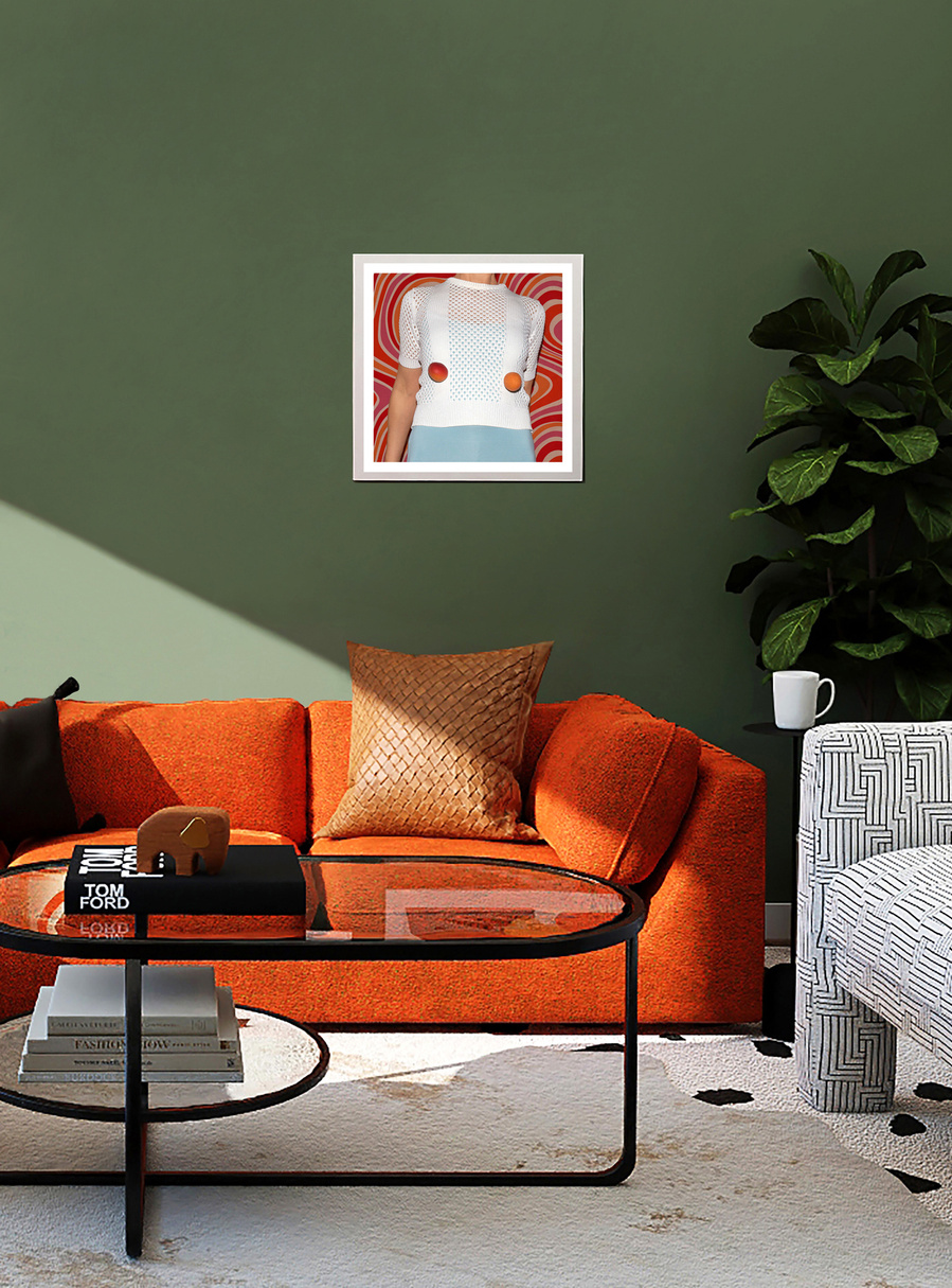 A colorful framed artwork by N. A. Vague hanging on a green wall in a stylish furnished living room