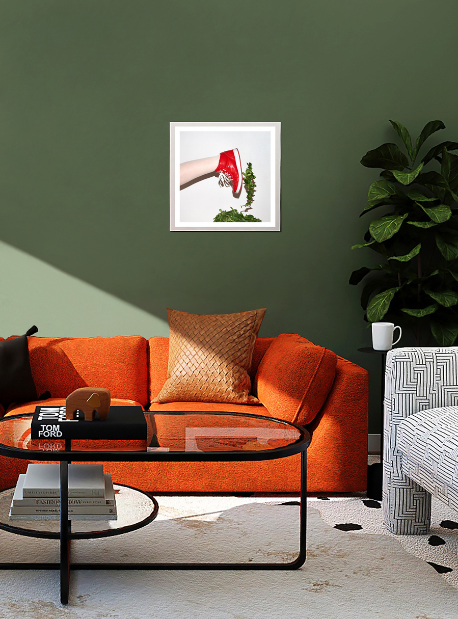 A limited edition fine art print by N. A. Vague hanging on a green wall in a stylish furnished living room