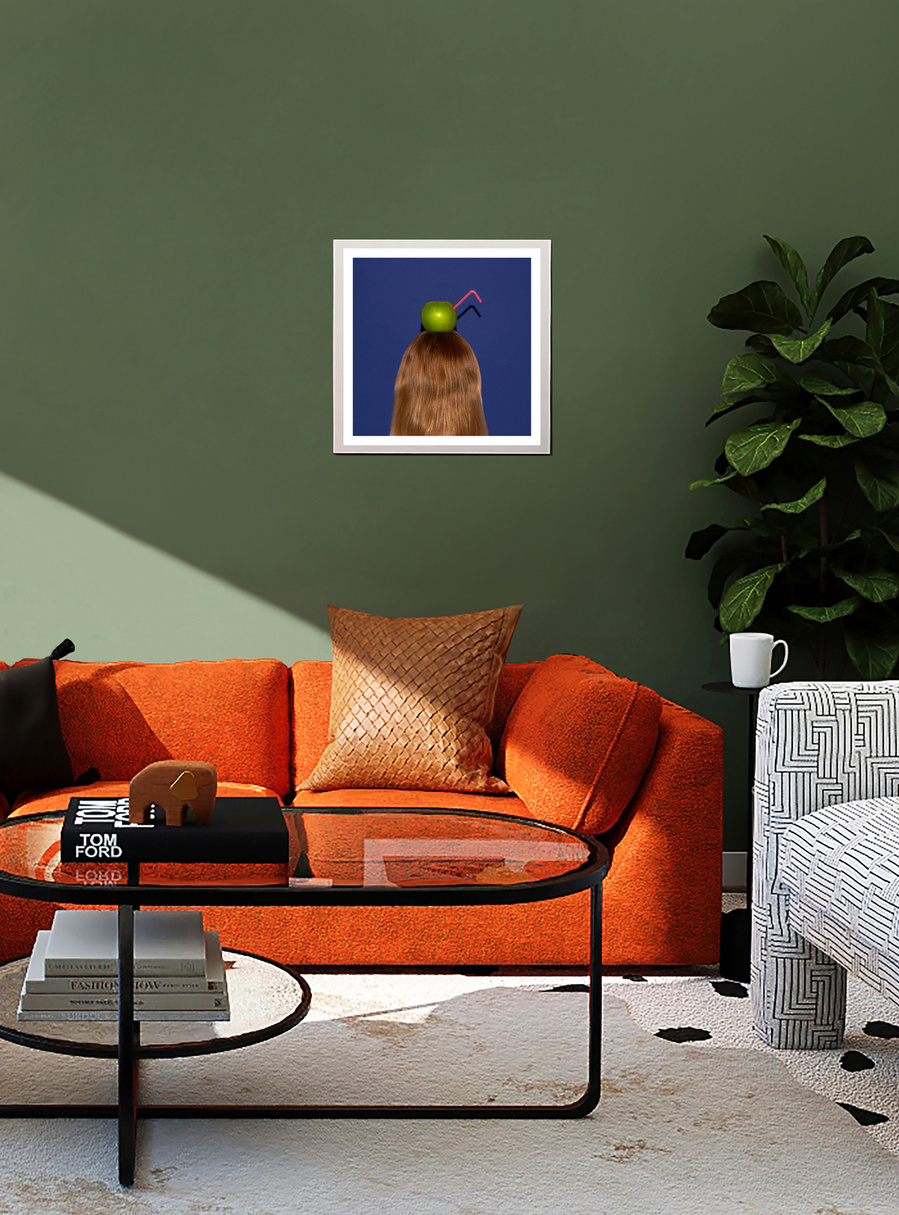 A framed photograph by N. A. Vague hanging on a green wall in a stylish furnished living room