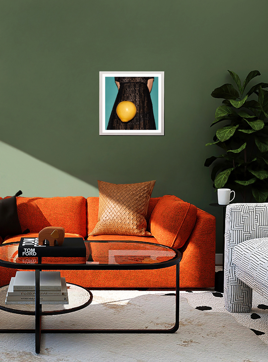 A framed limited edition fine art print by N. A. Vague hanging on a green wall in a stylish furnished living room