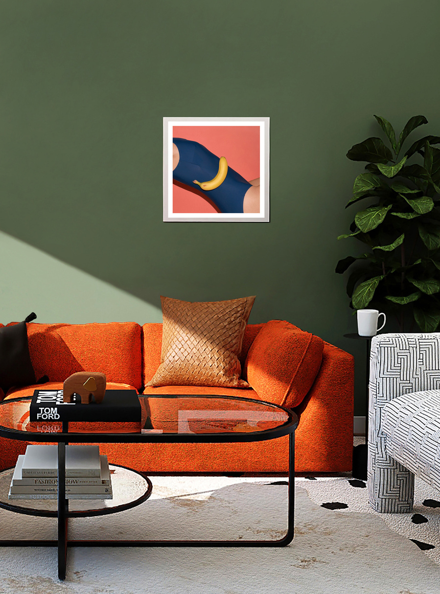 A bold colored artwork by N. A. Vague hanging on a green wall in a stylish furnished living room