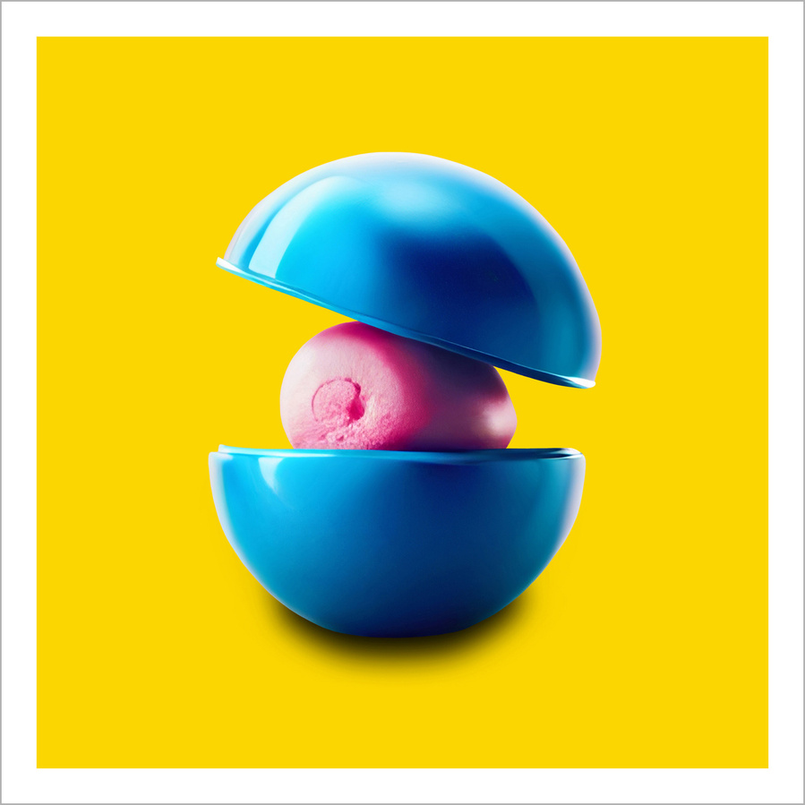 An inefinable oval shaped blue and pink object on a plain yellow background
