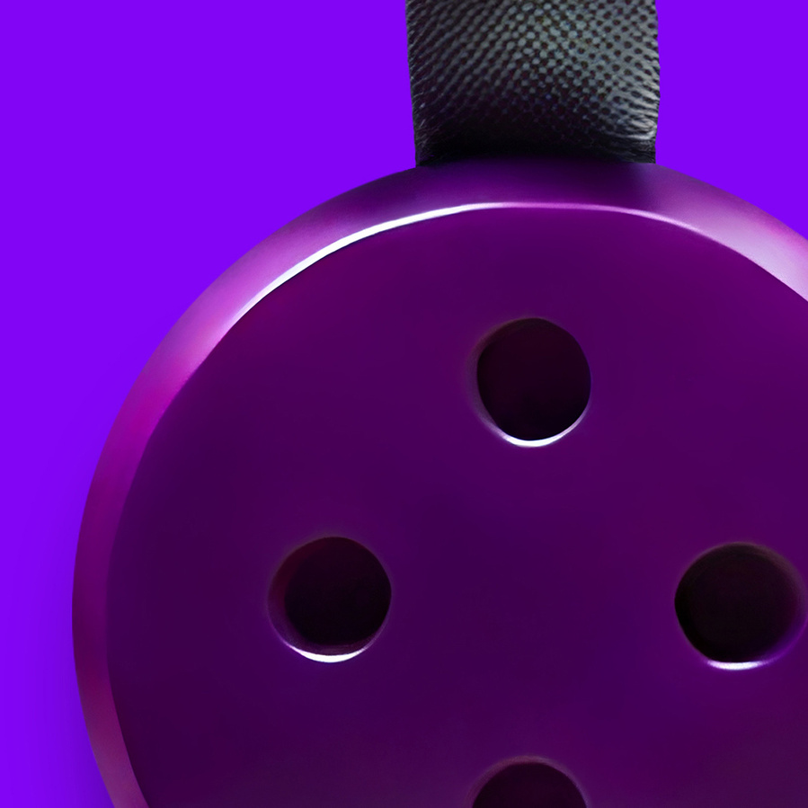 Close up of an inefinable round violet object on a plain violet background