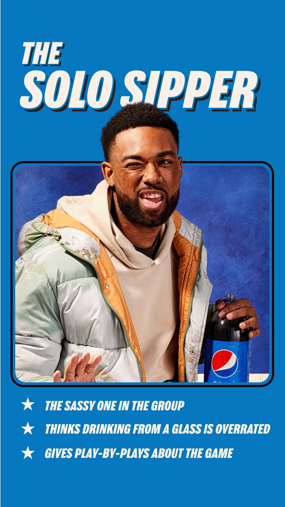 Guy holding a pepsi bottle against blue background for superbowl campaign advertisement. Shot by people + product photographer Cera Hensley in San Francisco Bay Area