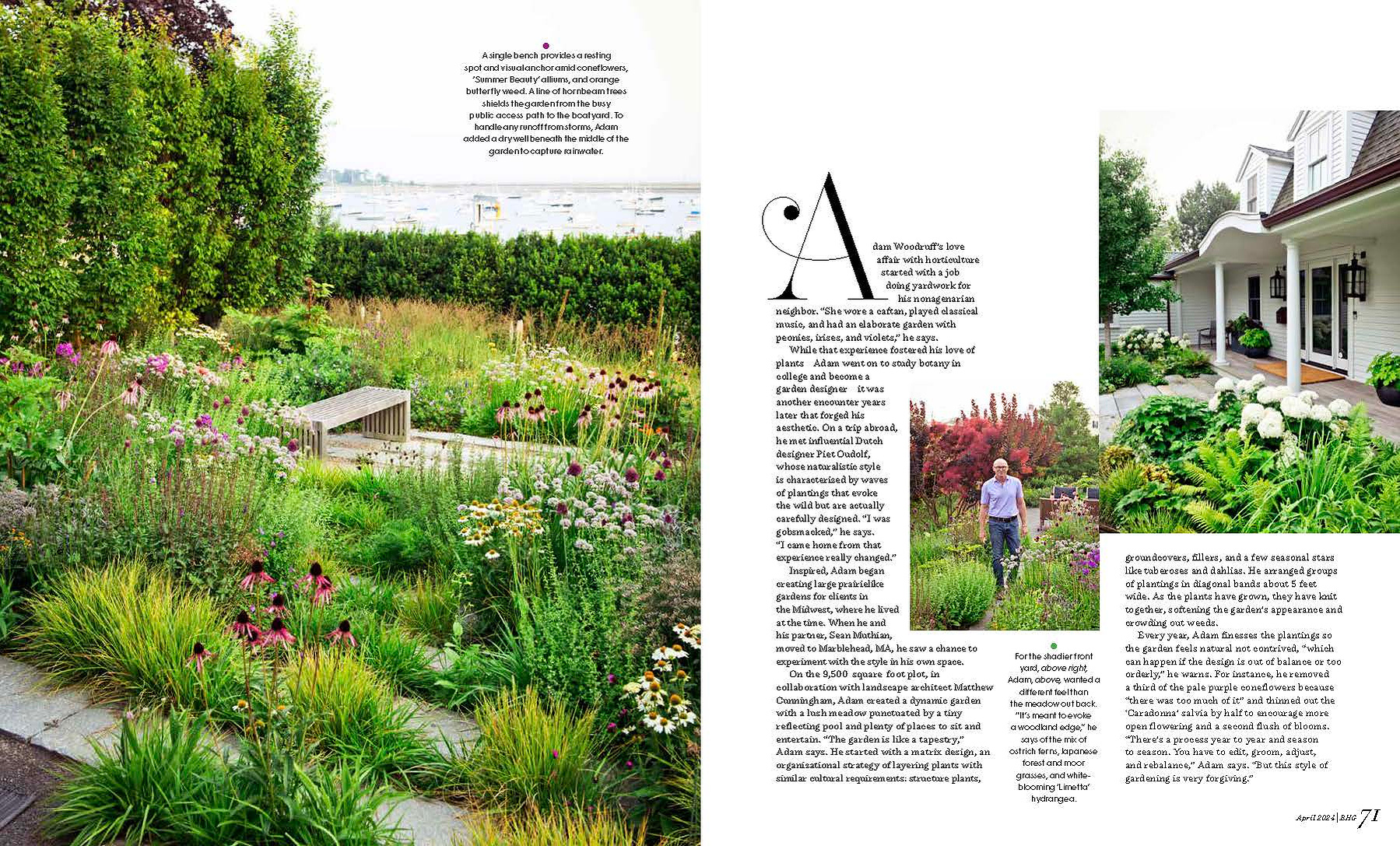 A lush coastal garden by Adam Woodruff with naturalistic plantings, a stone pathway, and a bench overlooking the water.