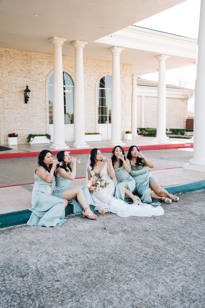 Bride & Bridal Party drinking champagne at Royal Oaks Country Club in Houston.