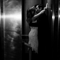 Newly wed couple kissing in an elevator in Houston, TX