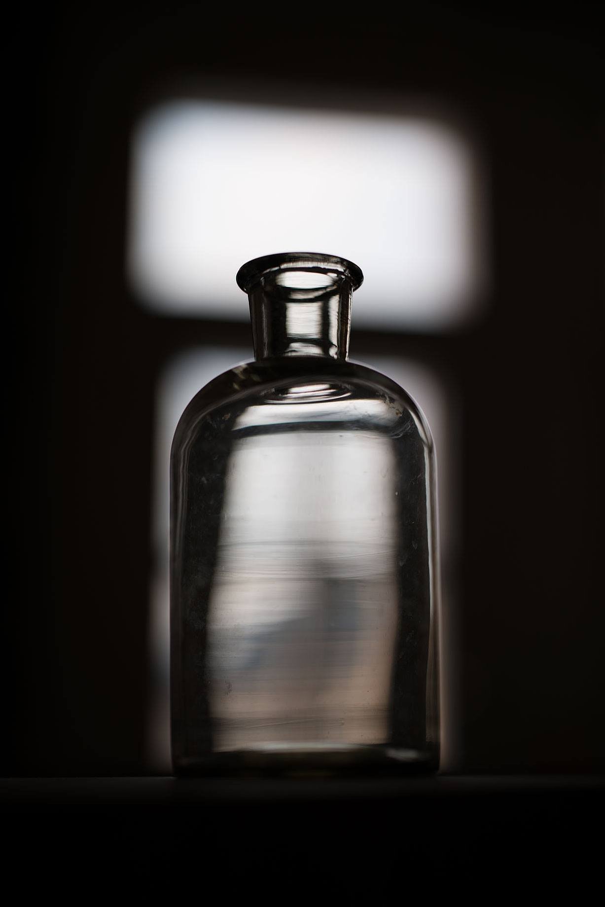 A picture of a bottle, taken with a NIkon D800 digital camera and a Carl Zeiss Otus lens, showcasing outstanding bokeh and other impressive qualities of this German engineered optical marvel.