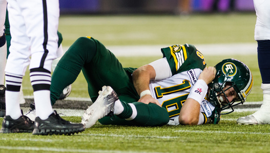 TORONTO, Ont. (11/11/2012) - Edmonton Eskimos’ quarterback, Matt Nichols dislocates his left ankle after being tackled during his Eastern semi-finals game against the Toronto Argonauts.  Players from both teams take a knee while the stadium was at a stand