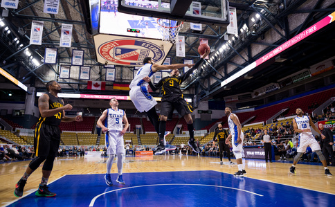 KITCHENER, Ont. (26/01/2017) - KW Titans Jamell Harris
#1 attempts to block London Lightning's Doug Herring Jr.'s #9 basket Friday night at The Aud in Kitchener.  KW lost to London 97-105.  Photo by Alicia Wynter