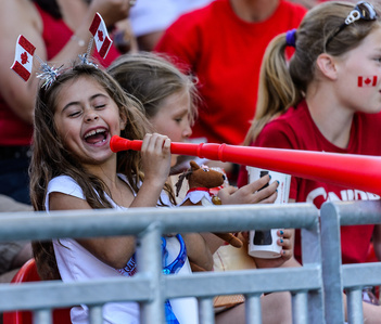 Toronto, Ontario (June 11, 2017) - A young fan enjoys herself at the Canada Women's National Team match against Costa Rica in Toronto, Ont. at the BMO Field Sunday evening.  Canada beat Costa Rica 6-0.

Photo by Alicia Wynter