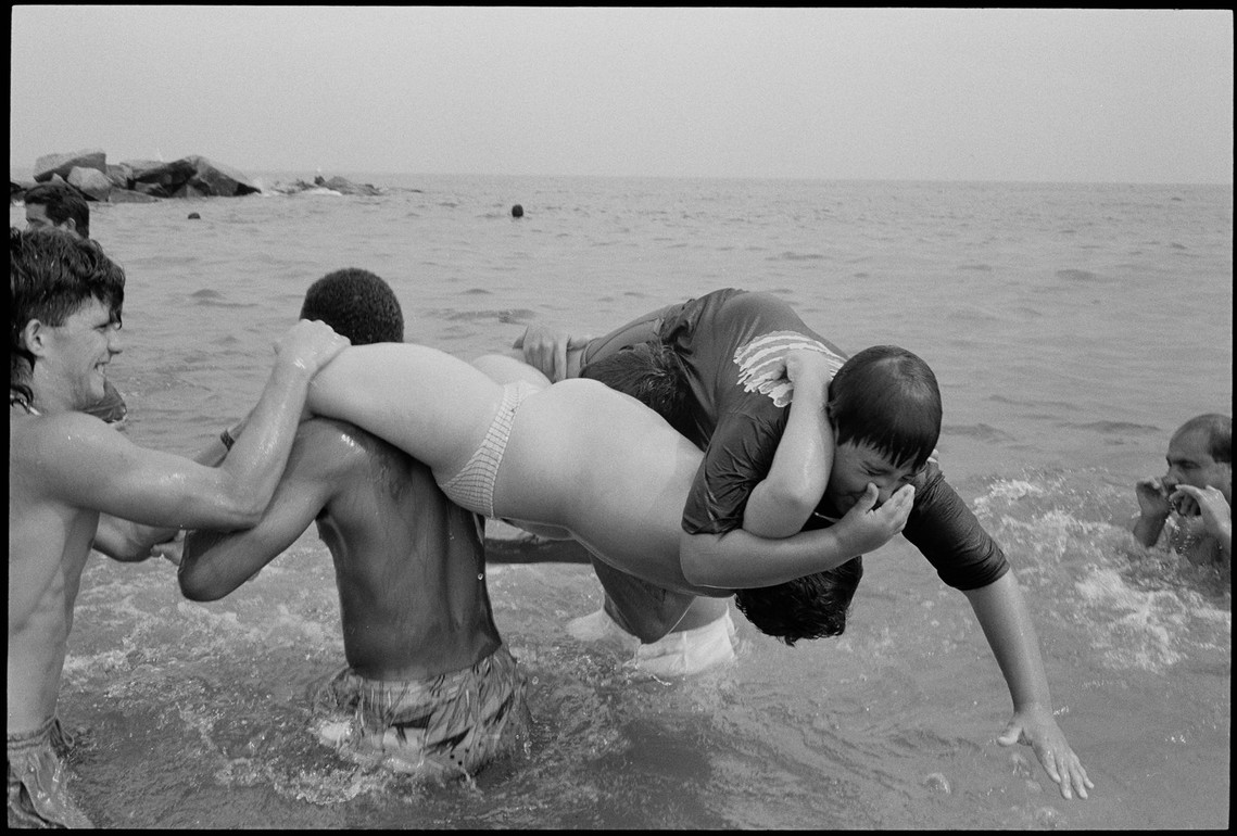 Nicholas Blair Photography copyright 1989, boys playing, surf, rough housing, black and white