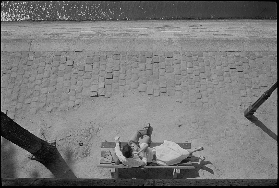 Nicholas Blair Photography copyright 1978, couple hugging on bench by La Siena River, romance, black and white