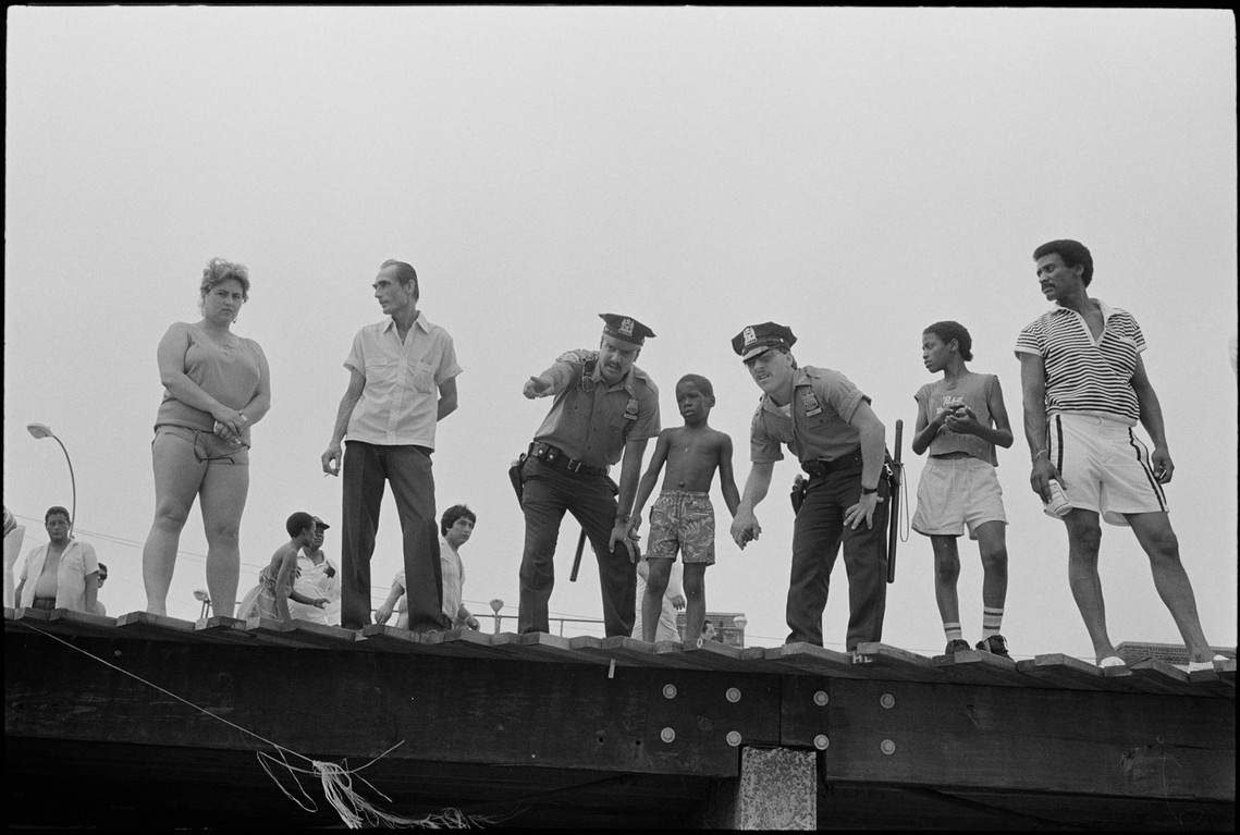 Nicholas Blair Photography copyright 1985, lost boy, police, urban scene, black and white