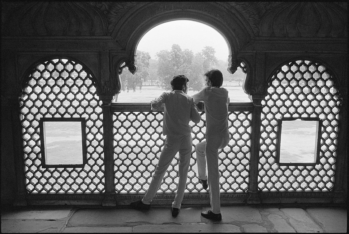 Nicholas Blair photography copyright 1989, black and white, islamic architecture, red fort, young men