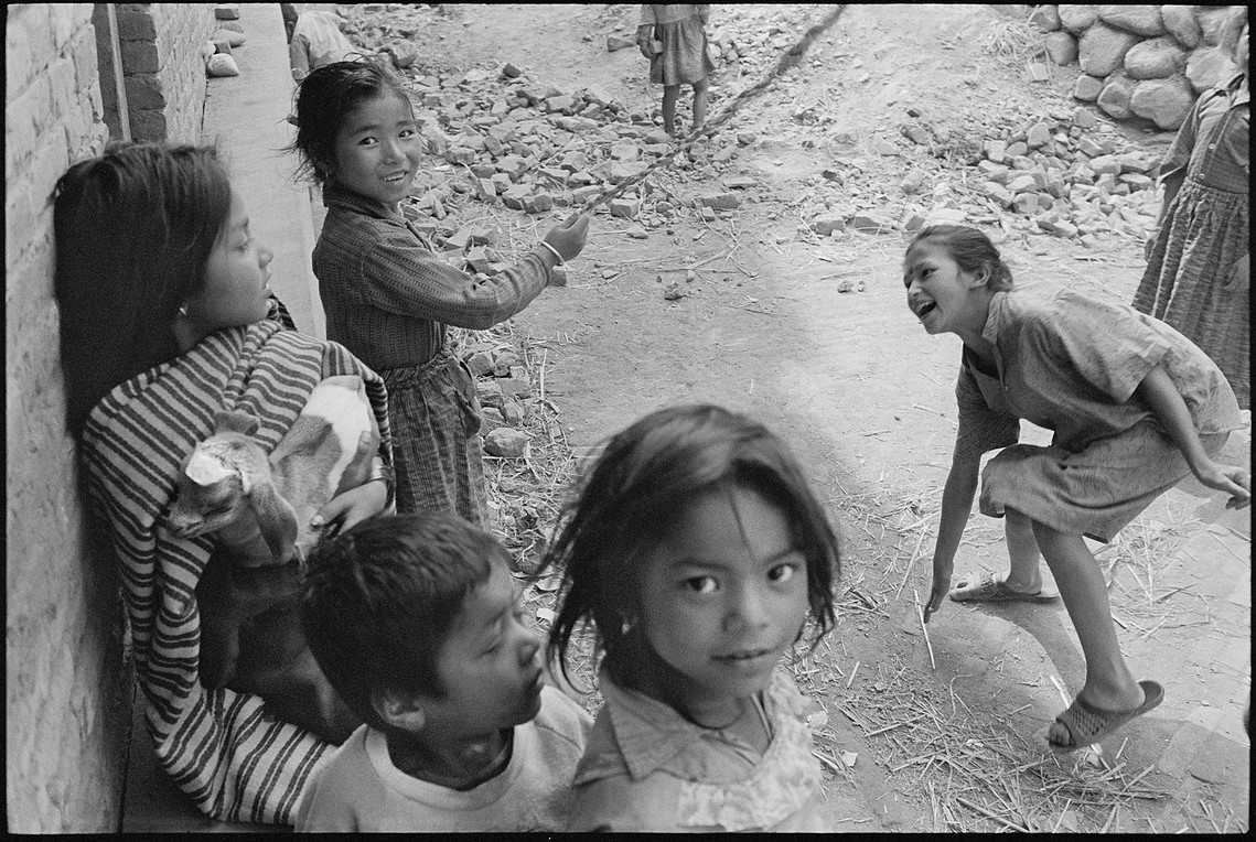 Nicholas Blair photography, 1990, black and white, children playing, jump rope, street scene