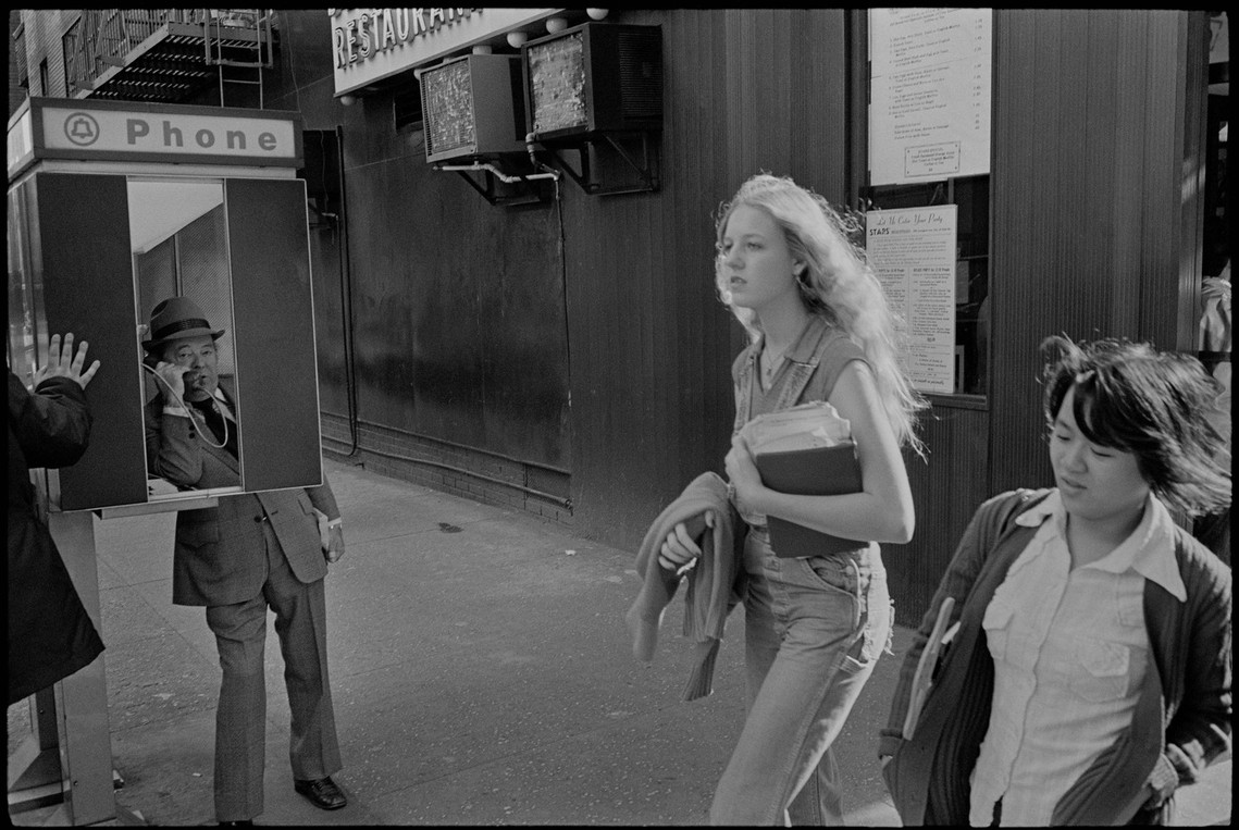 Nicholas Blair Photography copyright 1977, urban culture, pedestrians, phone booth, black and white