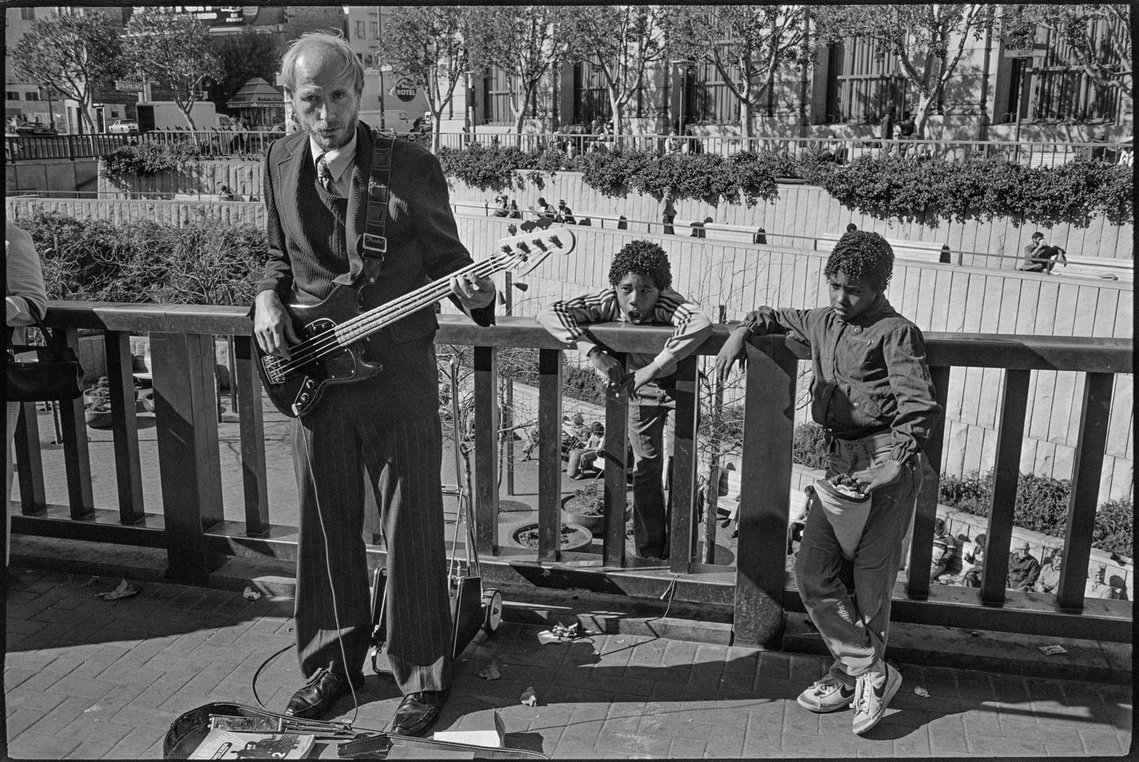 Nicholas Blair photography copyright 1977, black and white, San Francisco,  Street Musician, urban life