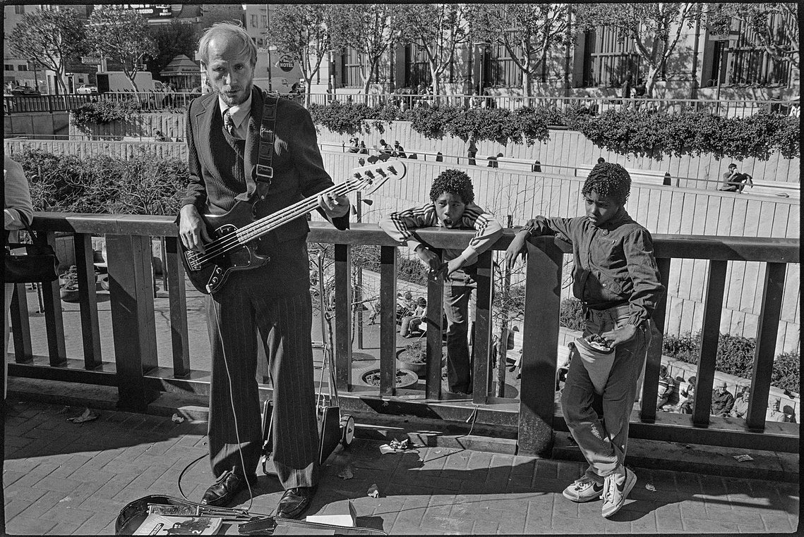 Nicholas Blair photography copyright 1977, black and white, San Francisco,  Street Musician, urban life