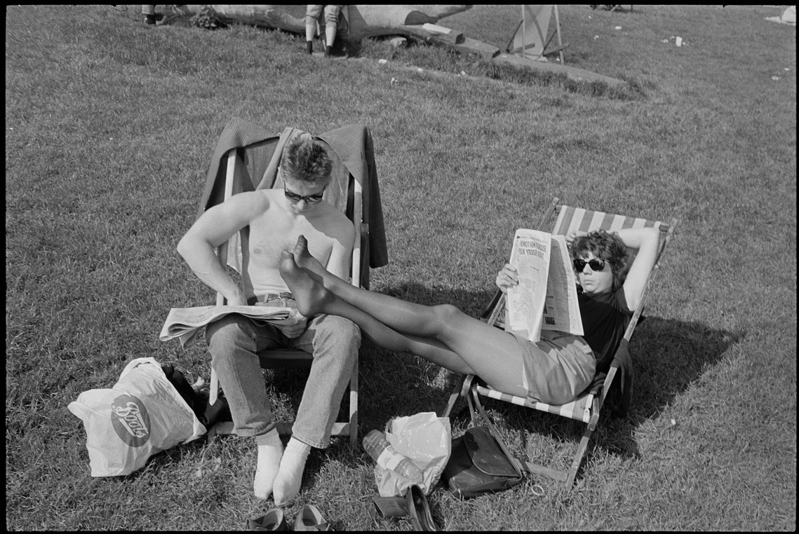 Nicholas Blair Photography copyright 1985, couple reading on lawn, black and white