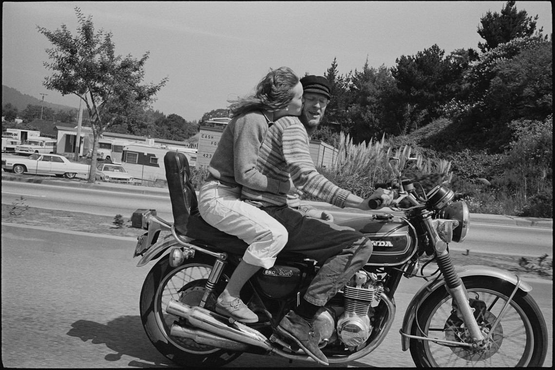 Nicholas Blair Photography copyright 1989, couple hugging on motorcycle, black and white