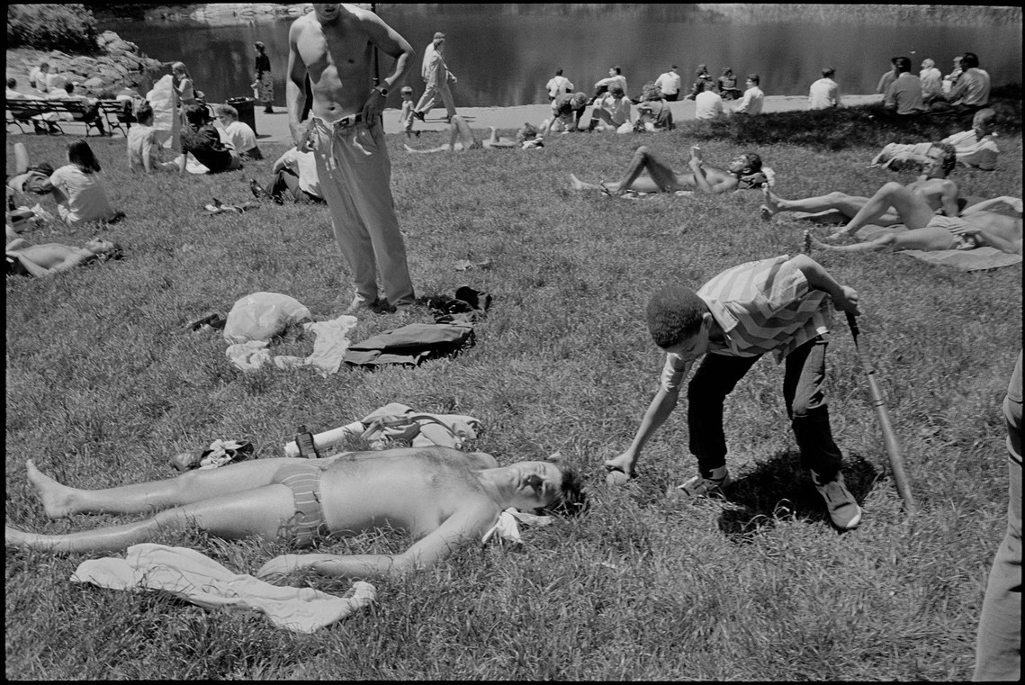 Nicholas Blair Photography copyright 1985, central park, sun bathing, boy with ball, black and white