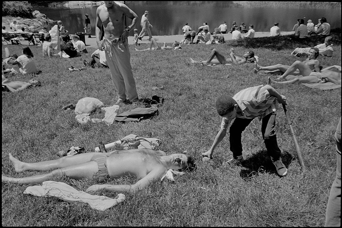 Nicholas Blair Photography copyright 1985, central park, sun bathing, boy with ball, black and white