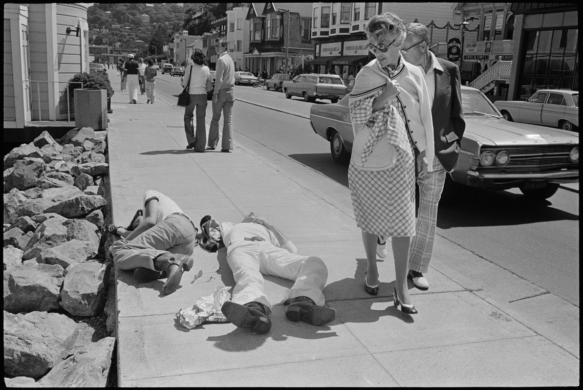 Nicholas Blair photography copyright 1977, black and white, Sausalito, people sleeping on sidewalk. urban life