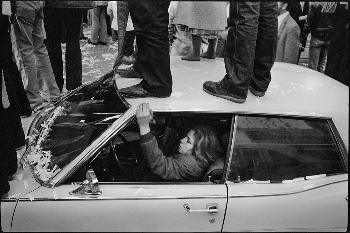 Nicholas Blair photography copyright 1982, black and white, San Francisco,  49's victory parade, people standing on cars, urban life