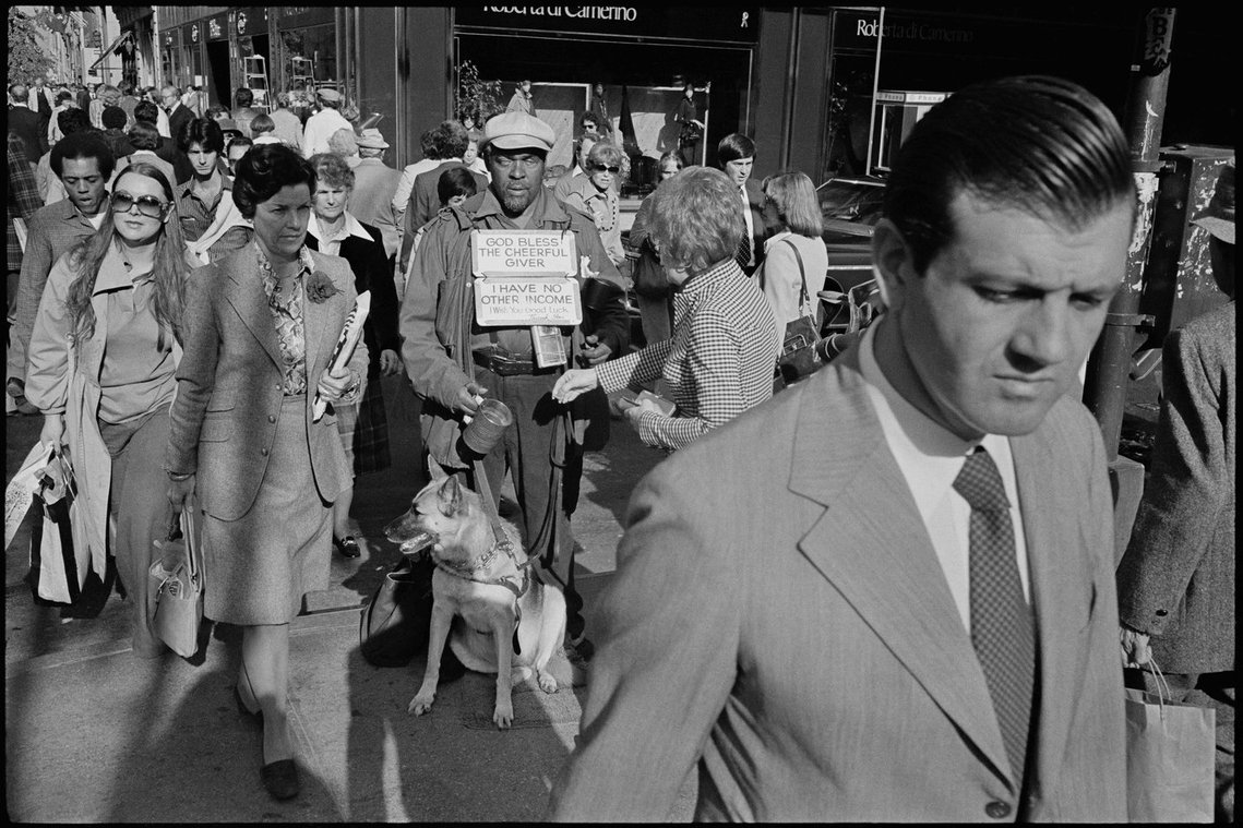 Nicholas Blair Photography copyright 1978, 5th avenue, urban culture, blind man, pan handling, street crowd, black and white