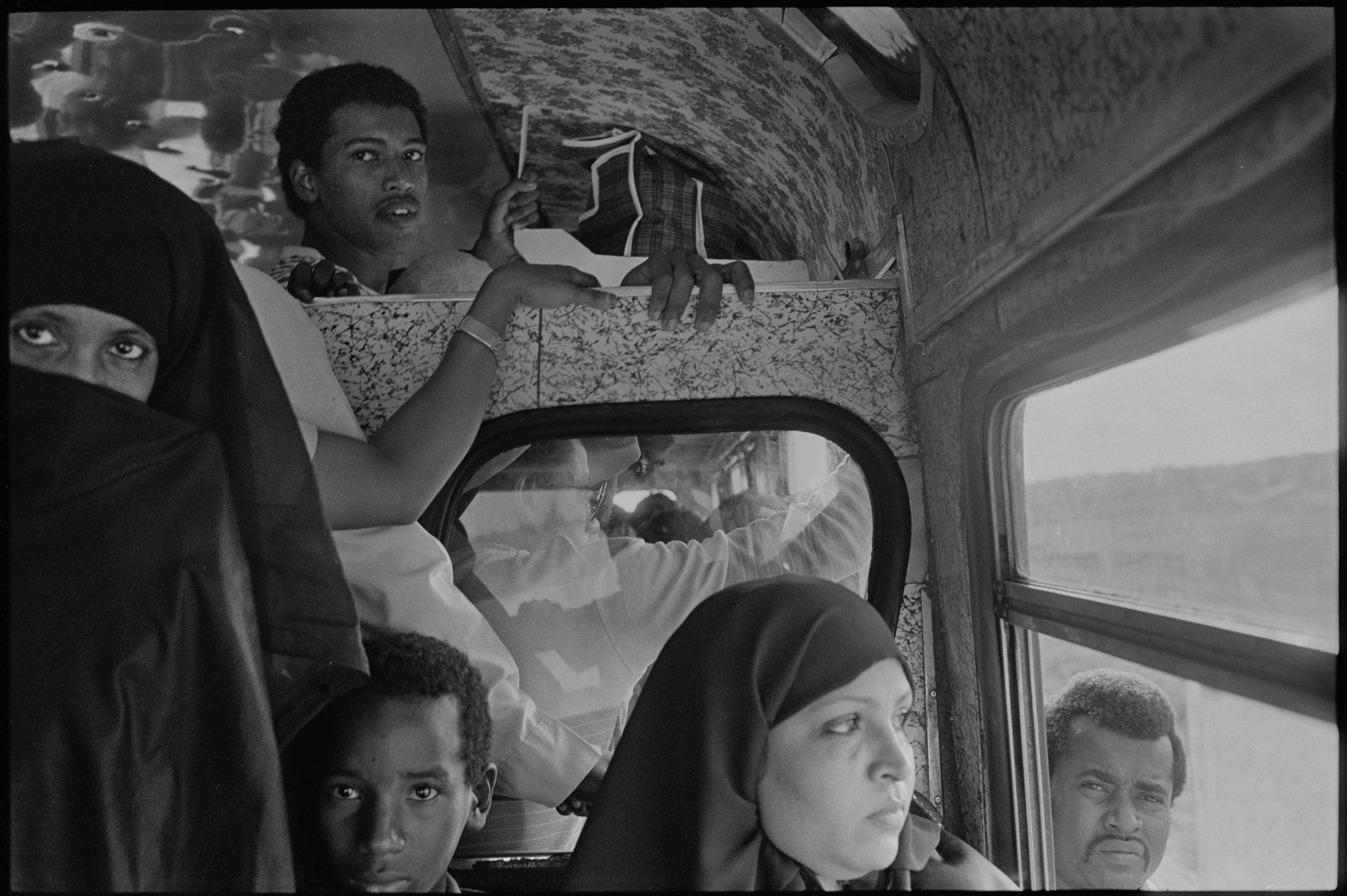 Nicholas Blair Photography copyright 1985, people in bus, moslem women, black and white