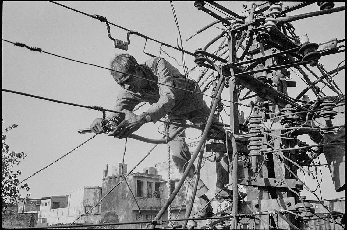 Nicholas Blair photography copyright 1978, black and white, lineman, worker