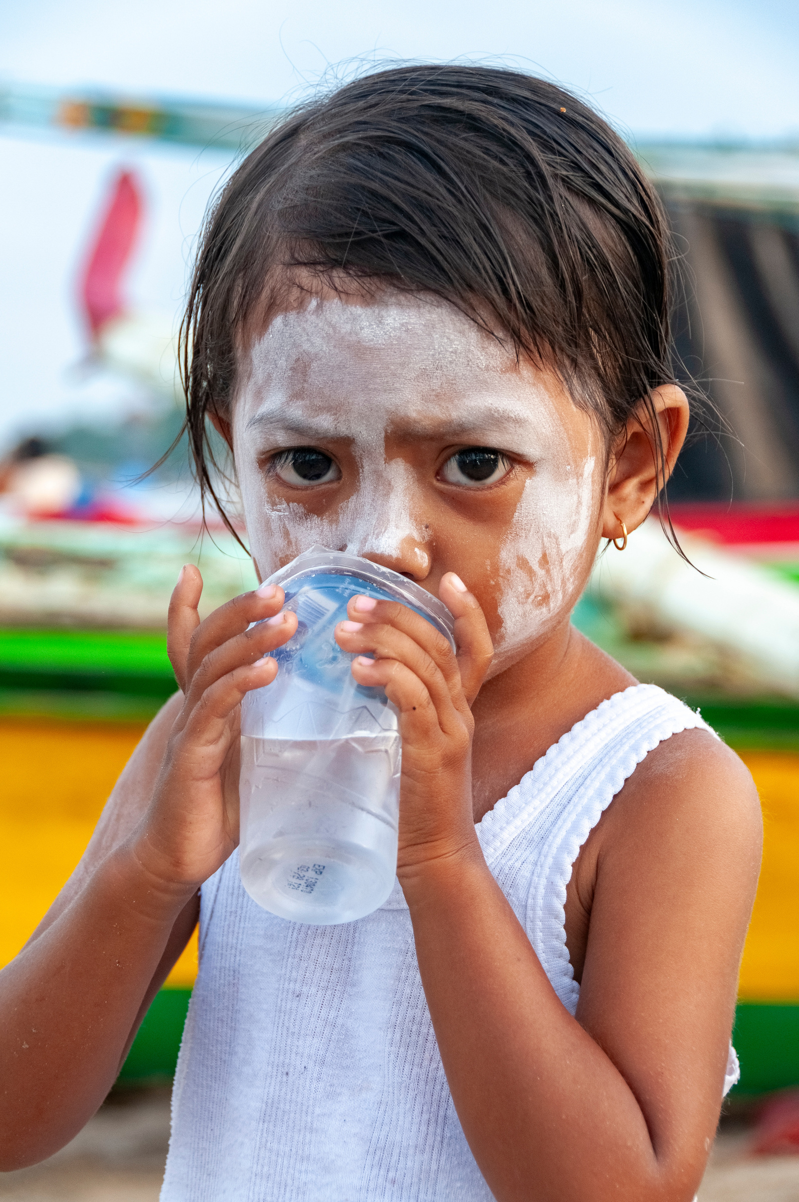 Young girl on fishing beach, Jimbaran Beach, Bali, Indonesia