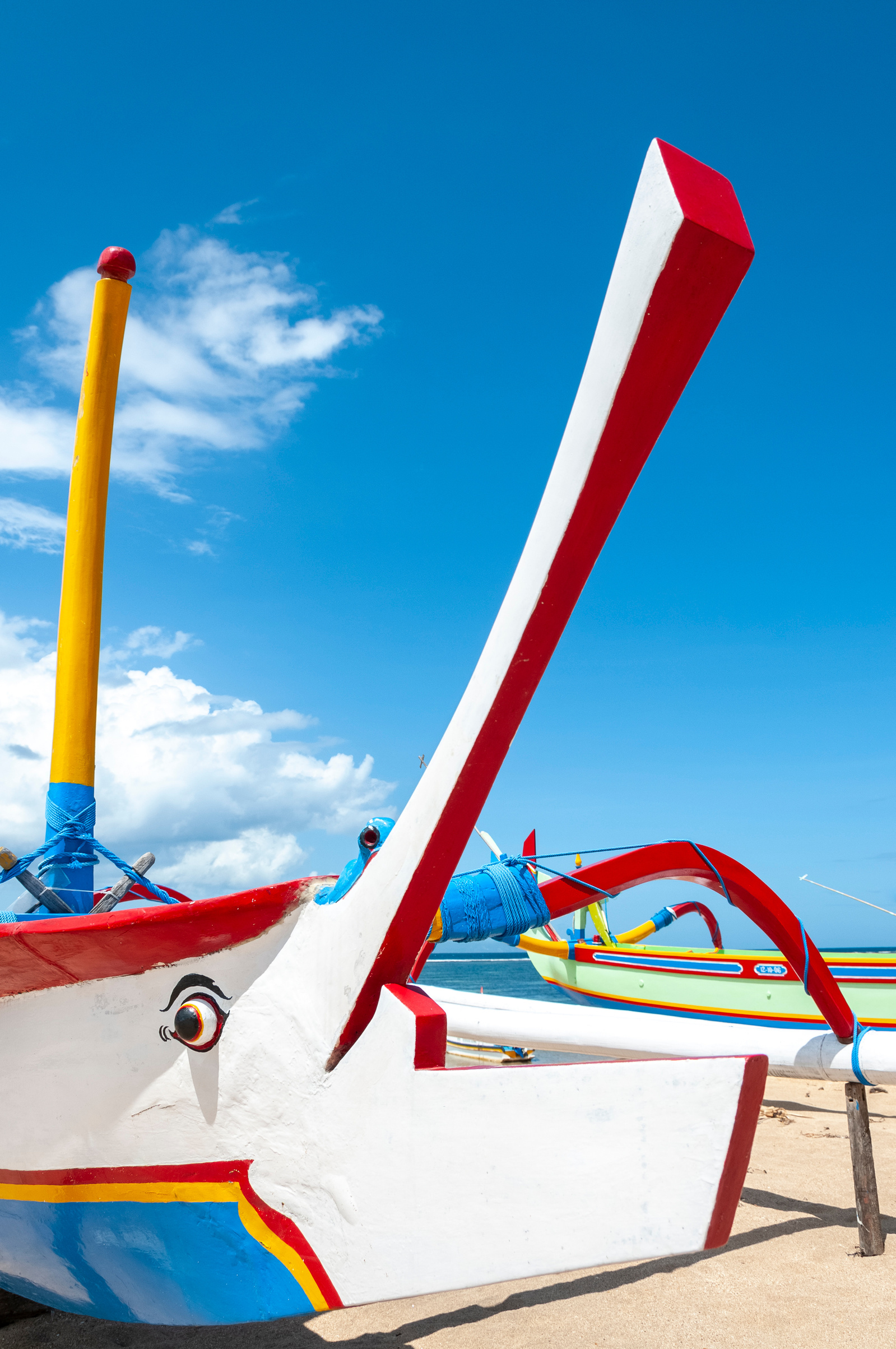 Traditional Jukung fishing boats on beach at Sanur, Bali, Indonesia