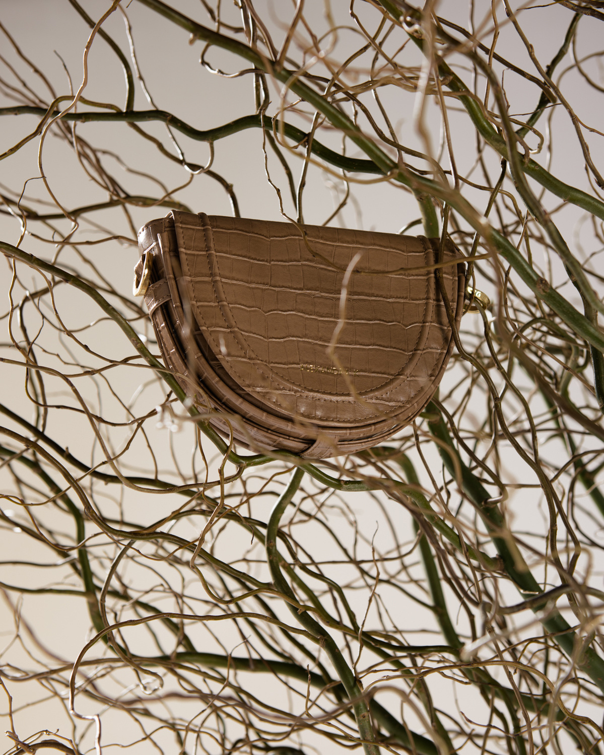 Brown, sustainable bag hanging on the tree.