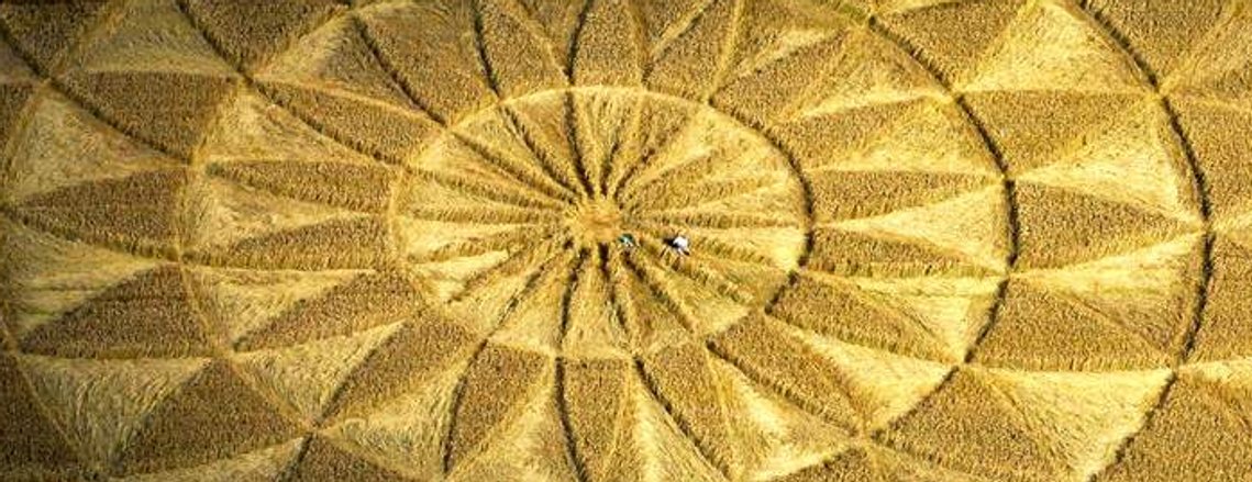 Wiltshire Geometric Crop Circle with people in the centre.
