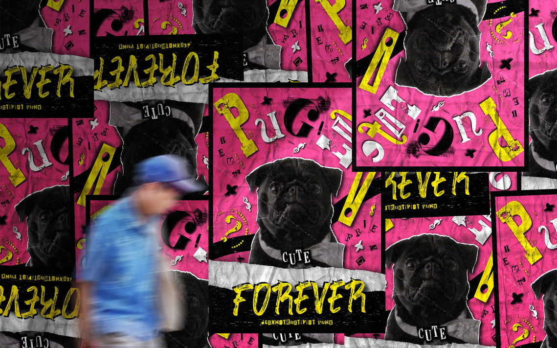 Several Pug Punk Subculture Movement Posters positioned at different angles against a wall, with a blurred figure walking past in the foreground.