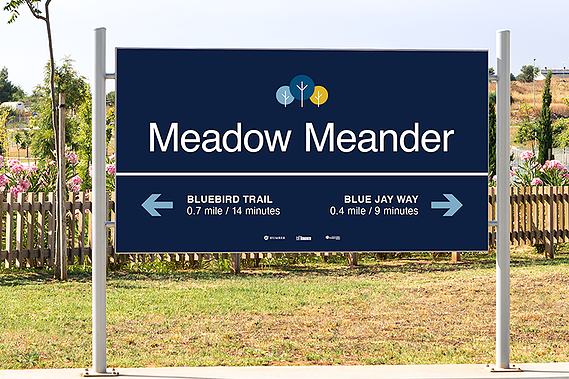 Image featuring a major destination sign placed along the edge of the pathway for visibility.